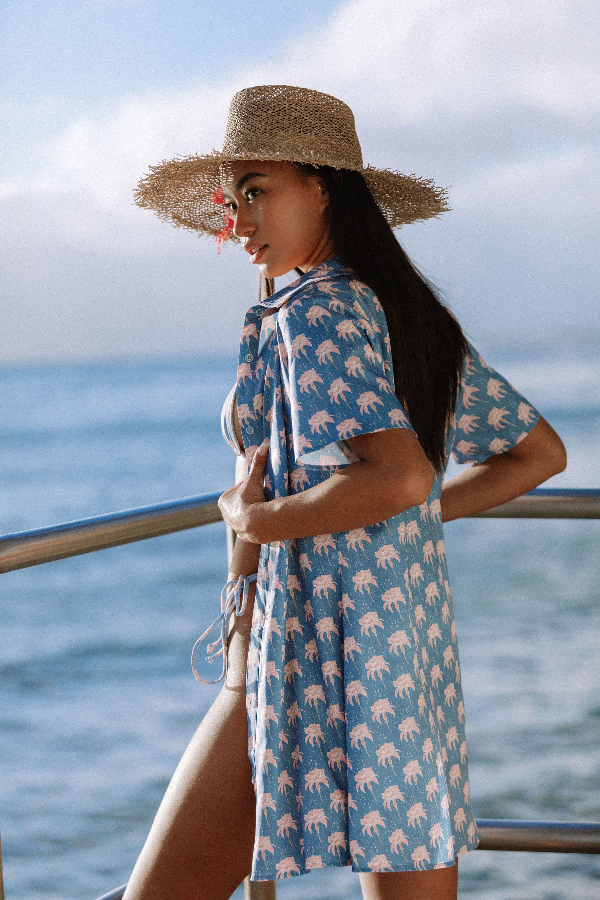 blue and white striped shirt dress with straw boater hat